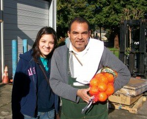 A Creighton student with a farmworker.